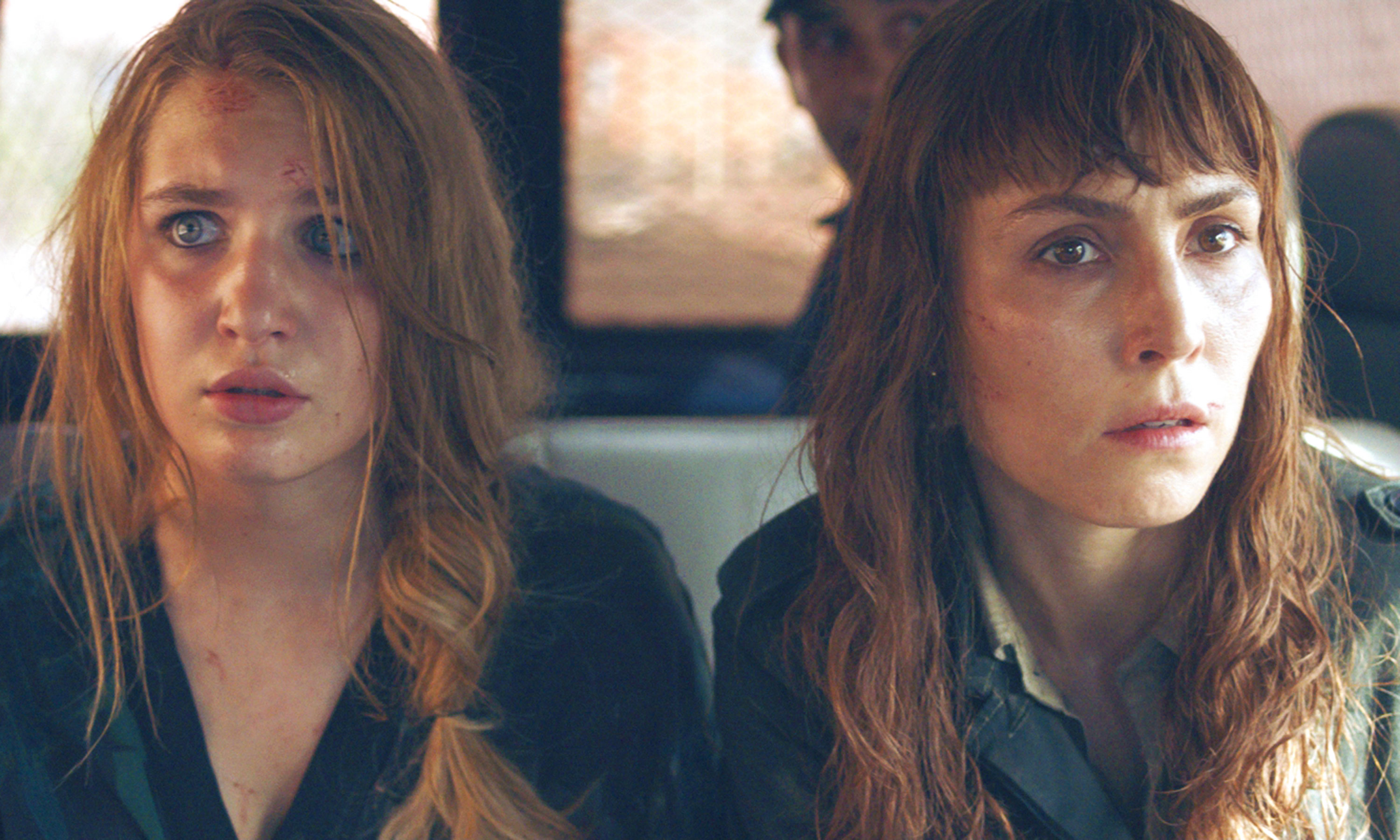 Sophie Nélisse as Zoe Tanner and Noomi Rapace as Sam Carlson in Close, directed by Vicky Jewson.