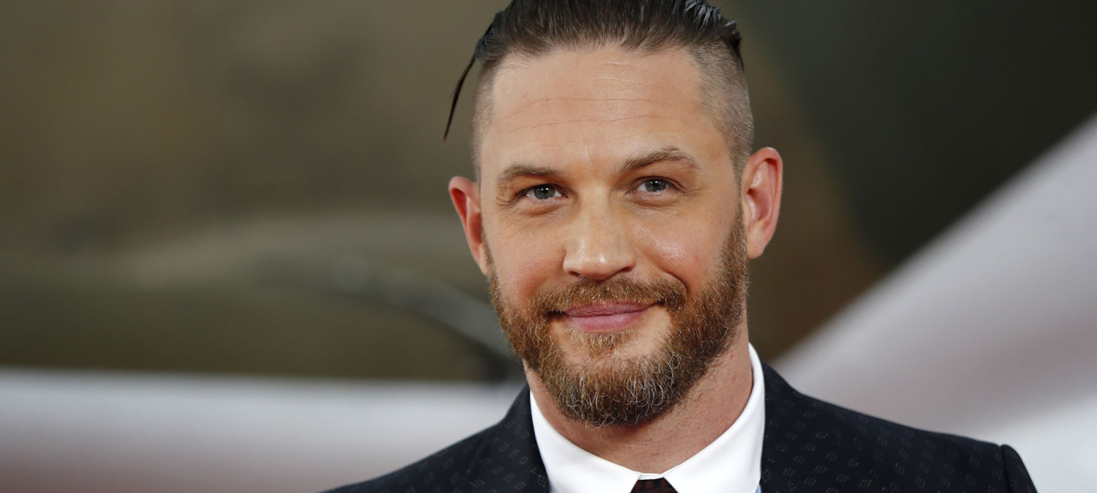 British actor Tom Hardy poses for a photograph upon arrival for the world premiere of "Dunkirk" in London on July 13, 2017.
 / AFP PHOTO / Tolga AKMEN        (Photo credit should read TOLGA AKMEN/AFP/Getty Images)