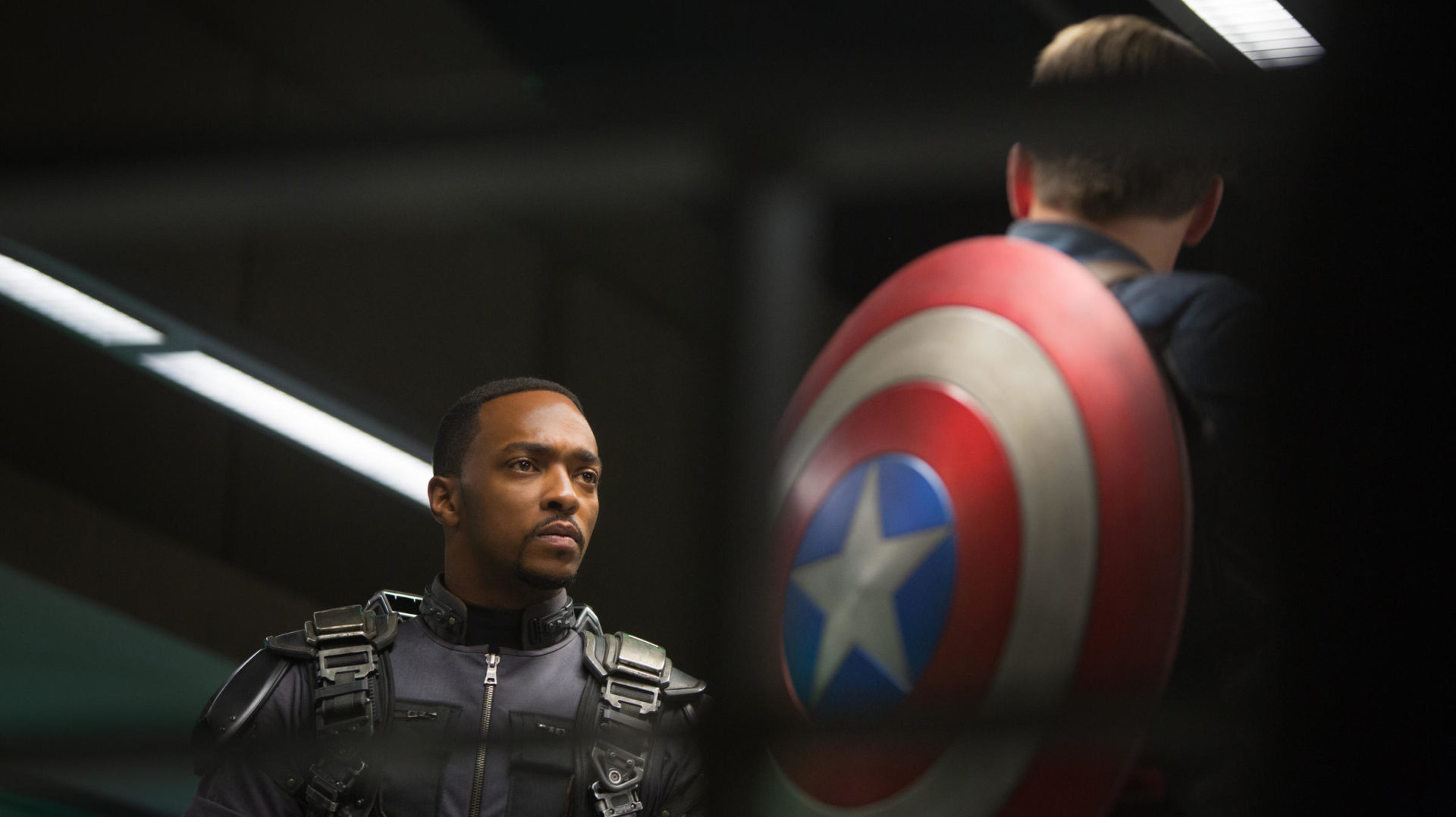 Anthony Mackie as Falcon and Chris Evans as Captain America.